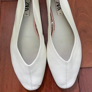 White leather flats